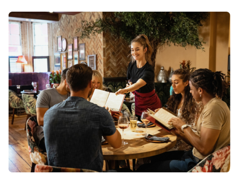 Waitress handing over menu